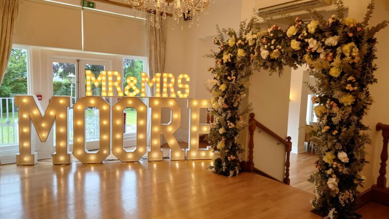 Flower arch and light up letters hire