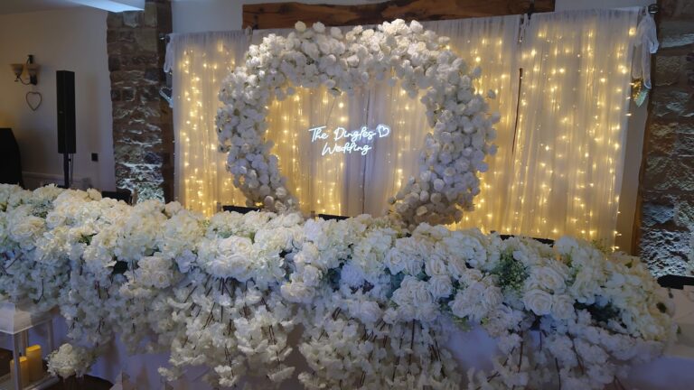 All white floral heart and top table flowers