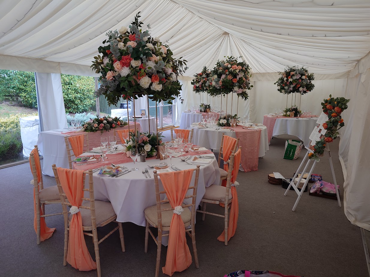 Wedding flowers in the marquee at the Cock O Barton